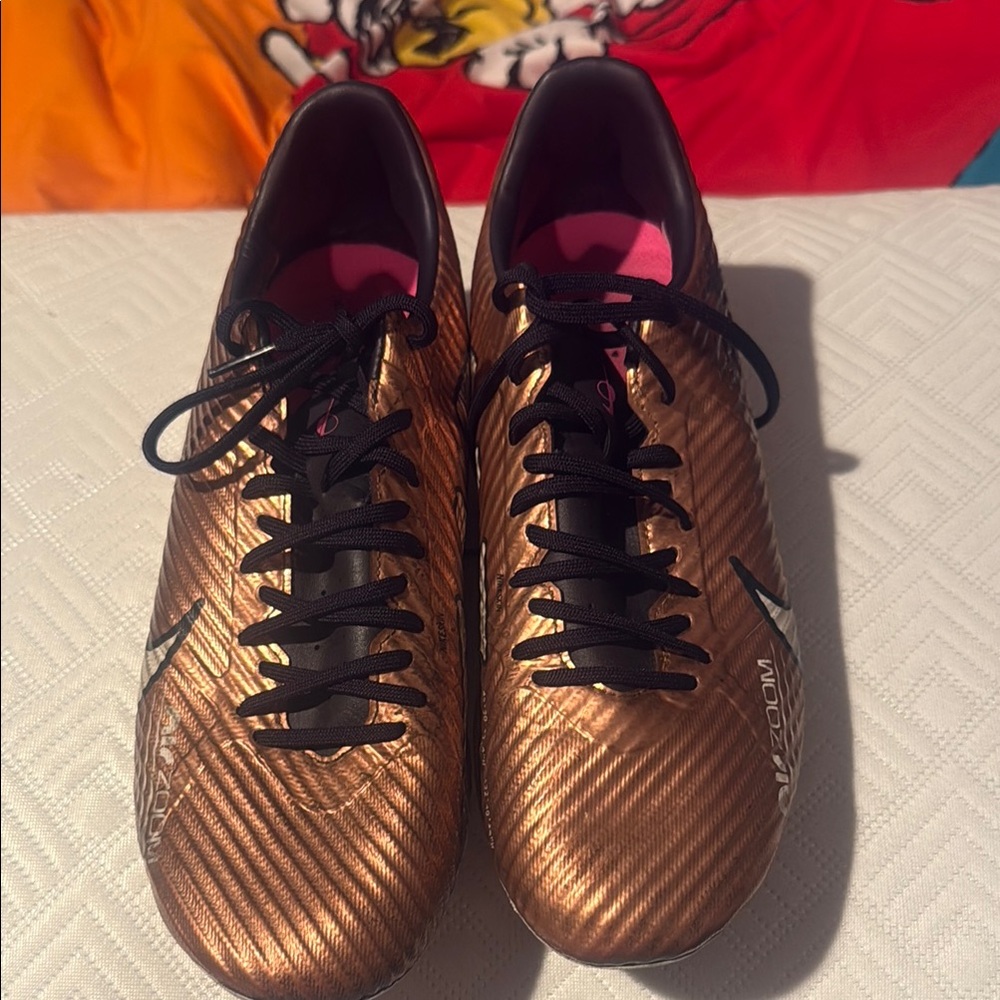 Nike Gold and Black Athletic Shoes with Sleek Design